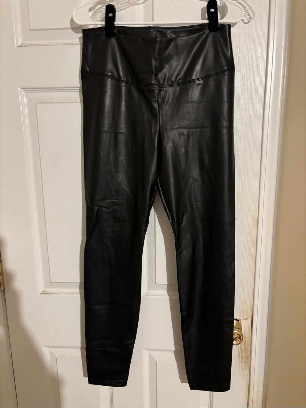 WHBM, NWOT-never worn, size 12. Glossy black vegan leather runway leggings